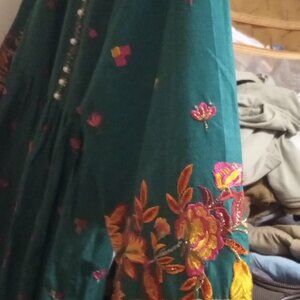 Teal or dark green Pakistani-style embroidered dress